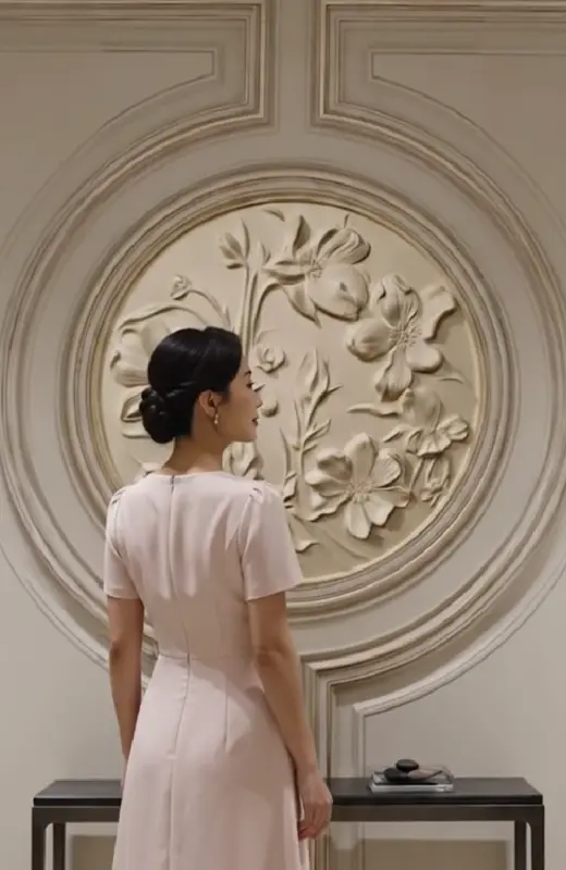 3d print flora wall decor with a young lady looking on it. This is superior than cnc engraving or craving as 3d print can achieve high detail and good finishing.