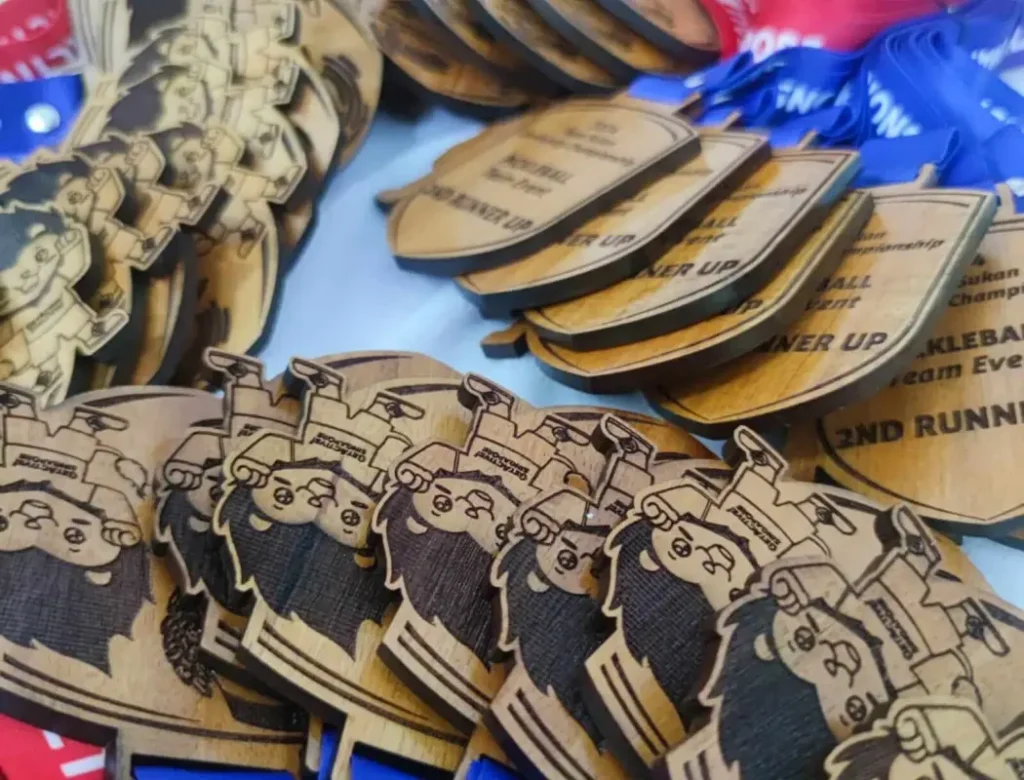 pekan sukan 2024 medal compiled before delivery. We are using sustainable mahogany wood for this event.