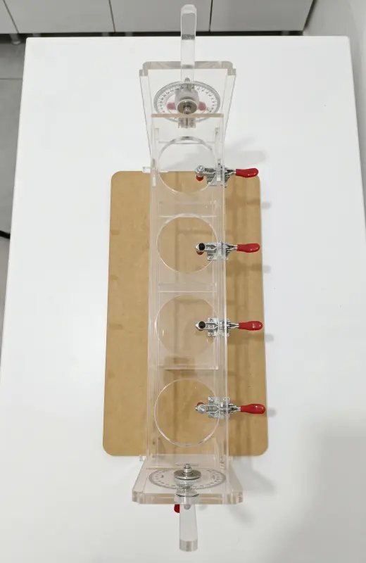 lubrizol flowability test kit has 4 slot for beakers and they can be hold in position with clamps. 
